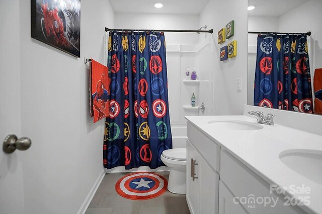 2013 Eastway Dr, Dallas, NC 28034 - bathroom with shower / bathtub combination with curtain, double vanity, toilet, recessed lighting, and baseboards