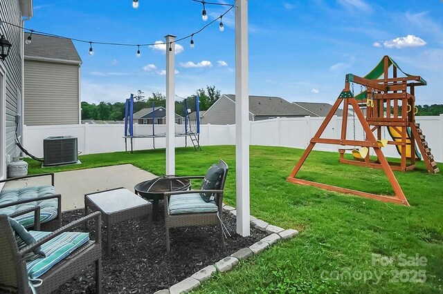 2013 Eastway Dr, Dallas, NC 28034 - view of patio / terrace with central air condition unit, a playground, and a fire pit