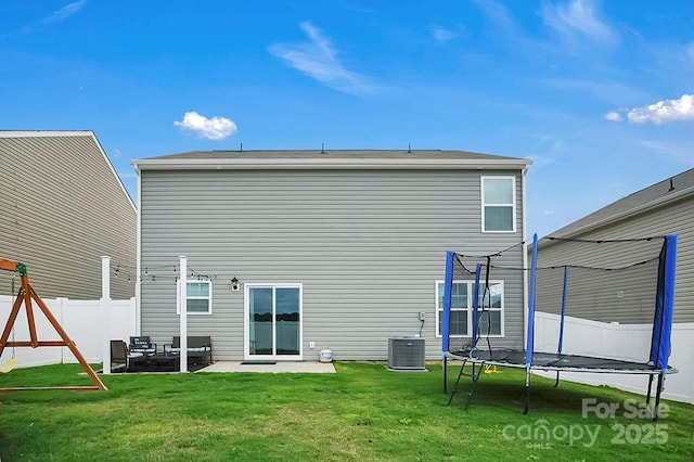 2013 Eastway Dr, Dallas, NC 28034 - back of property with a trampoline, a patio area, and cooling unit