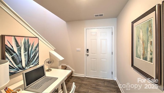 5137 Hyrule Dr, Charlotte, NC 28262 - entryway featuring dark wood-style flooring and baseboards