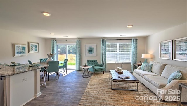 5137 Hyrule Dr, Charlotte, NC 28262 - living area with wood finished floors, recessed lighting, and baseboards