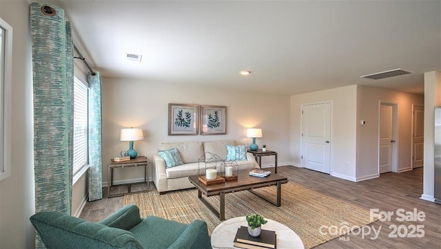 5137 Hyrule Dr, Charlotte, NC 28262 - living room featuring wood finished floors, baseboards, and recessed lighting