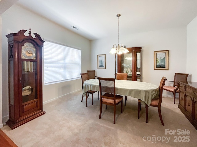 1228 Tranquil Falls Ln, Matthews, NC 28104 - dining room with light carpet, a chandelier, and baseboards