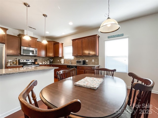 1228 Tranquil Falls Ln, Matthews, NC 28104 - dining room with recessed lighting and baseboards