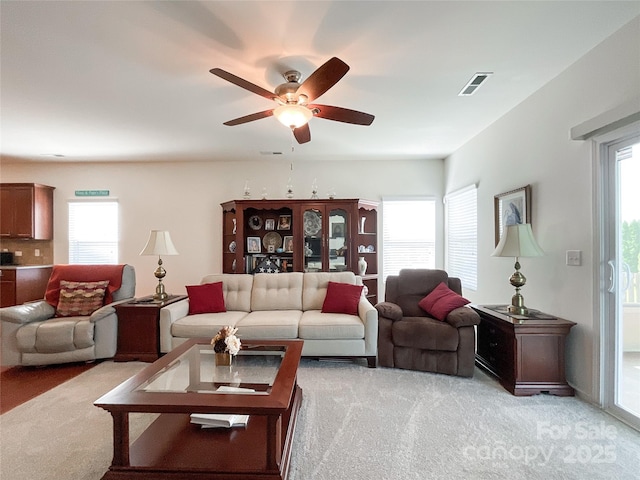 1228 Tranquil Falls Ln, Matthews, NC 28104 - living room featuring light carpet, ceiling fan, and plenty of natural light