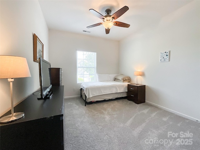 1228 Tranquil Falls Ln, Matthews, NC 28104 - bedroom featuring light carpet, baseboards, ceiling fan, and a desk