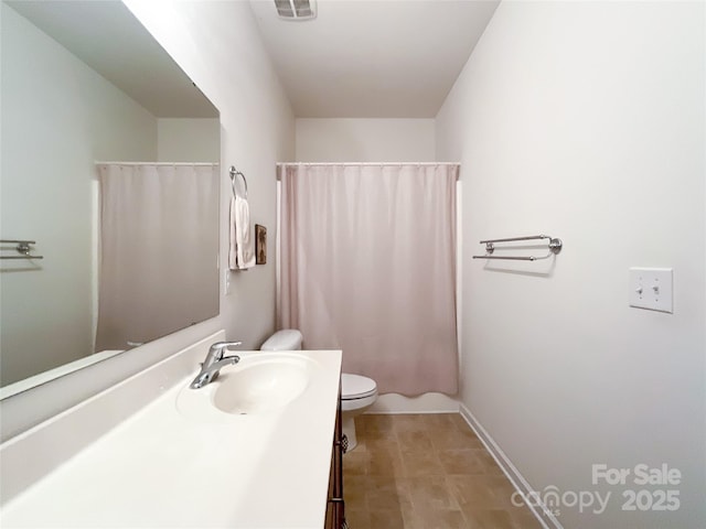 1228 Tranquil Falls Ln, Matthews, NC 28104 - full bath with toilet, vanity, baseboards, and a shower with shower curtain