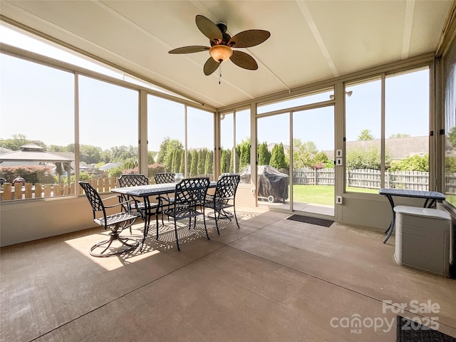 1228 Tranquil Falls Ln, Matthews, NC 28104 - sunroom / solarium featuring ceiling fan, lofted ceiling, outdoor dining area, and healthy amount of natural light