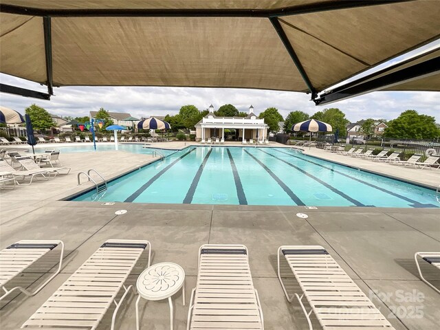 1228 Tranquil Falls Ln, Matthews, NC 28104 - community pool with a patio