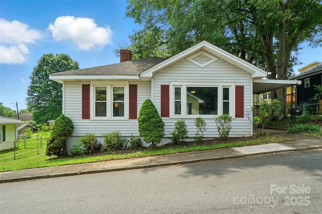 435 16th St, Cramerton, NC 28032 - view of front of property featuring a chimney, a shingled roof, and an attached carport