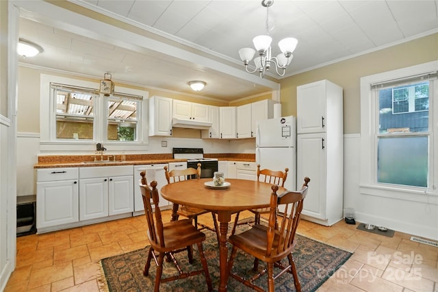 435 16th St, Cramerton, NC 28032 - dining room with ornamental molding, a chandelier, and wainscoting