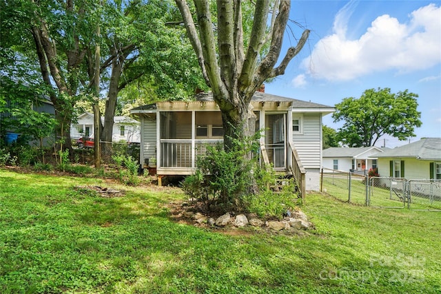 435 16th St, Cramerton, NC 28032 - rear view of house featuring a fenced backyard, a sunroom, and a gate