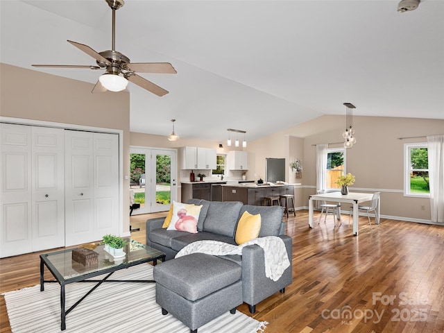 71 Midnight Ln, Waynesville, NC 28786 - living area featuring lofted ceiling, wood finished floors, ceiling fan, baseboards, and french doors