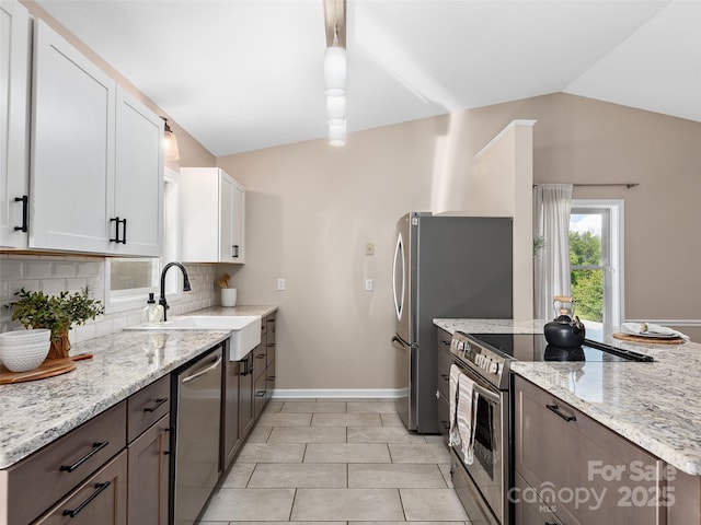 71 Midnight Ln, Waynesville, NC 28786 - kitchen with stainless steel appliances, a sink, white cabinets, decorative backsplash, and light stone countertops