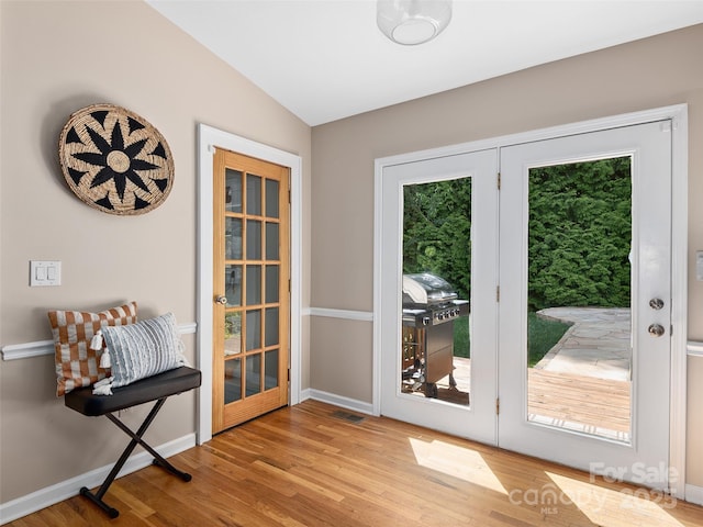 71 Midnight Ln, Waynesville, NC 28786 - doorway with wood finished floors, vaulted ceiling, baseboards, and french doors