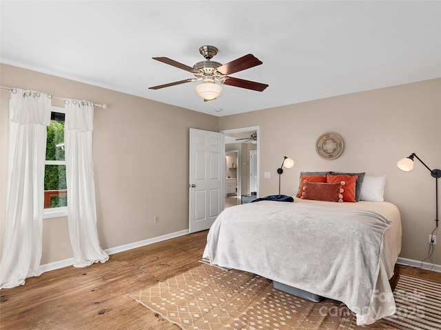 71 Midnight Ln, Waynesville, NC 28786 - bedroom with baseboards, wood finished floors, and a ceiling fan