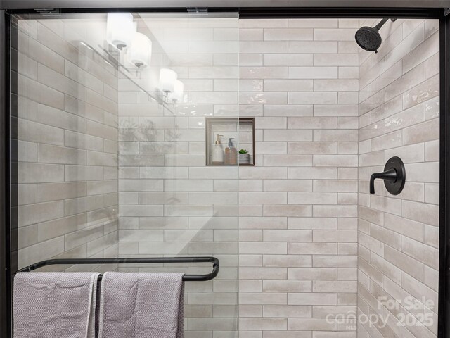 71 Midnight Ln, Waynesville, NC 28786 - full bathroom featuring a stall shower and a chandelier