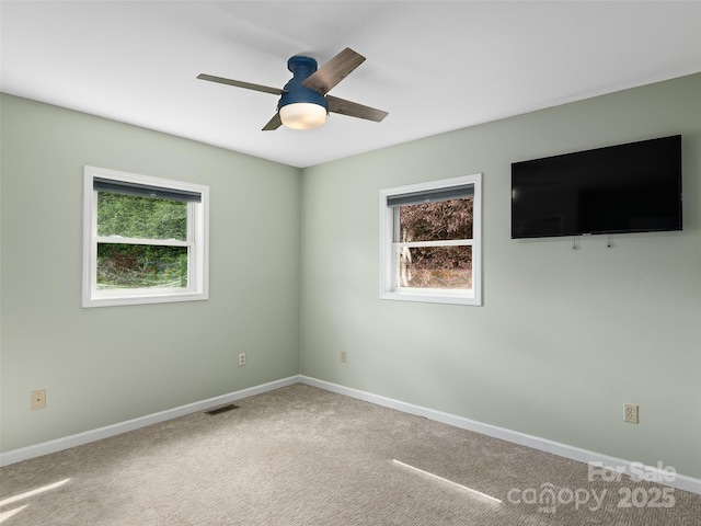 71 Midnight Ln, Waynesville, NC 28786 - carpeted spare room with plenty of natural light, ceiling fan, and baseboards