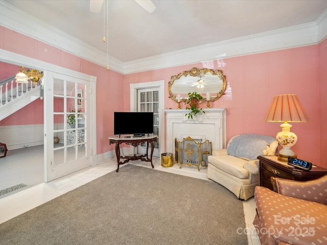 408 S Ellis St, Salisbury, NC 28144 - carpeted living area featuring ornamental molding, stairs, ceiling fan, and a fireplace