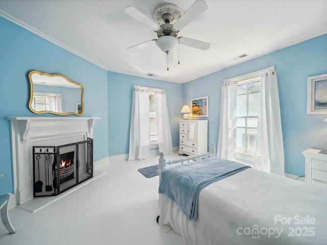 408 S Ellis St, Salisbury, NC 28144 - bedroom featuring a warm lit fireplace, crown molding, and a ceiling fan
