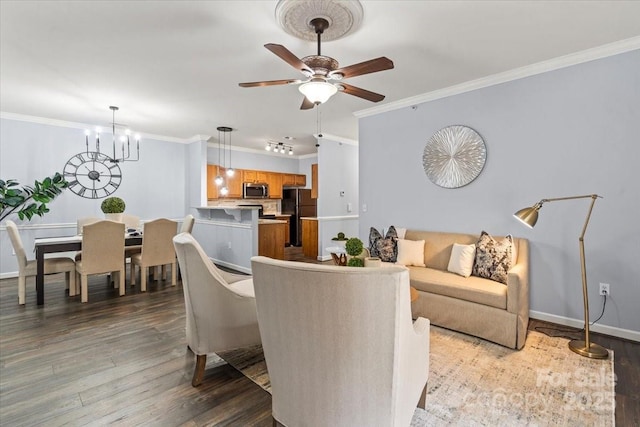 11911 Ridgeway Park Dr, Charlotte, NC 28277 - living area featuring wood finished floors, ornamental molding, ceiling fan, and baseboards