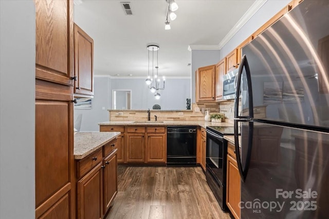 11911 Ridgeway Park Dr, Charlotte, NC 28277 - kitchen featuring black appliances, dark wood-style flooring, a sink, ornamental molding, and backsplash