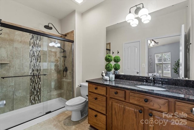 11911 Ridgeway Park Dr, Charlotte, NC 28277 - full bathroom with a shower stall, toilet, vanity, a chandelier, and tile patterned flooring