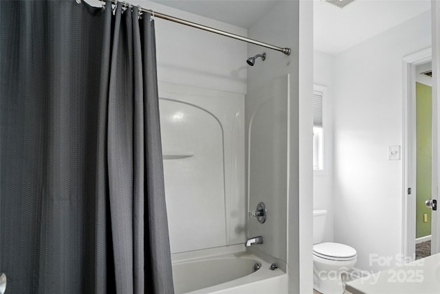 1522 Napa St NW, Concord, NC 28027 - bathroom featuring shower / bathtub combination with curtain, toilet, and baseboards