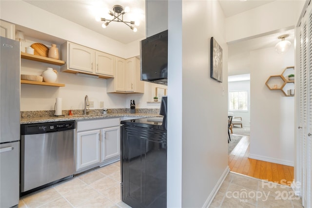 3615 Maple Glenn Ln, Charlotte, NC 28226 - kitchen featuring stainless steel appliances, a sink, a chandelier, light stone countertops, and light tile patterned flooring