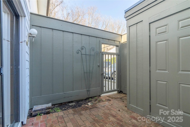 3615 Maple Glenn Ln, Charlotte, NC 28226 - property entrance with a gate and board and batten siding