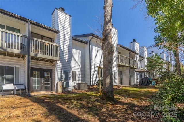 3615 Maple Glenn Ln, Charlotte, NC 28226 - back of house with french doors, a balcony, a chimney, and central air condition unit
