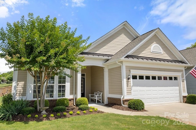 2066 Vermount Way, Indian Land, SC 29707 - view of front facade with an attached garage, driveway, a standing seam roof, a shingled roof, and a metal roof