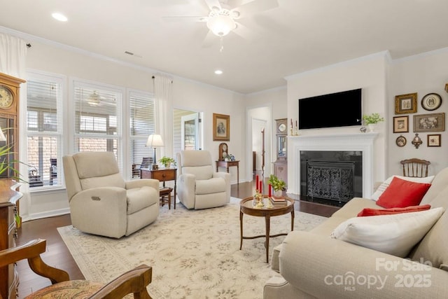 2066 Vermount Way, Indian Land, SC 29707 - living area featuring wood finished floors, a ceiling fan, a fireplace with flush hearth, crown molding, and recessed lighting