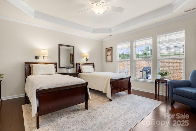 2066 Vermount Way, Indian Land, SC 29707 - bedroom featuring a raised ceiling, wood finished floors, ornamental molding, and a ceiling fan