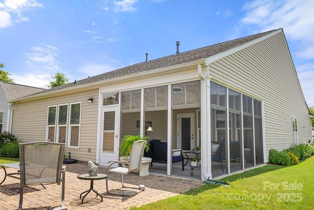 2066 Vermount Way, Indian Land, SC 29707 - rear view of house featuring a sunroom, a patio area, a shingled roof, and a lawn