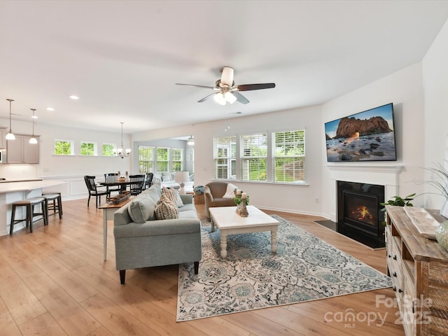 200 Sweet Briar Dr, Fort Mill, SC 29707 - living room with light wood finished floors, a fireplace with flush hearth, a ceiling fan, and recessed lighting