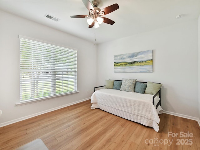 200 Sweet Briar Dr, Fort Mill, SC 29707 - bedroom with baseboards, multiple windows, and wood finished floors