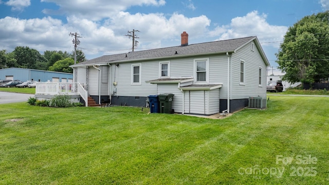 1266 18th St NE, Hickory, NC 28601 - back of property featuring a chimney, cooling unit, a lawn, a deck, and roof with shingles