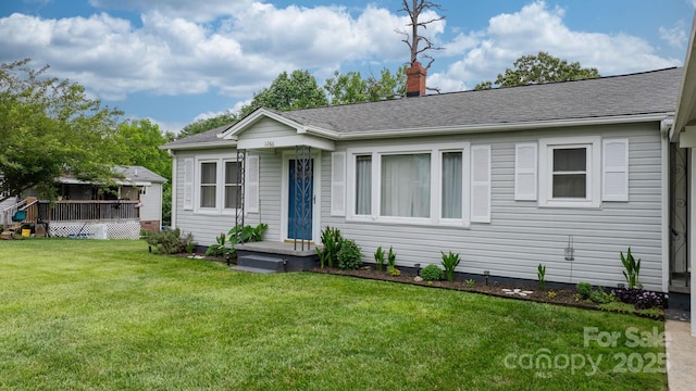1266 18th St NE, Hickory, NC 28601 - view of front facade featuring a chimney, a front yard, a deck, and roof with shingles