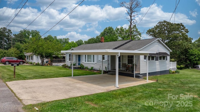 1266 18th St NE, Hickory, NC 28601 - view of front of property featuring a front lawn, a chimney, concrete driveway, a carport, and a shingled roof
