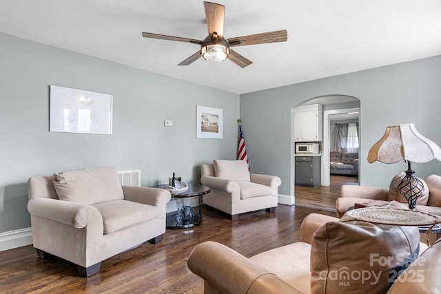 1266 18th St NE, Hickory, NC 28601 - living room with arched walkways, a ceiling fan, dark wood finished floors, and baseboards