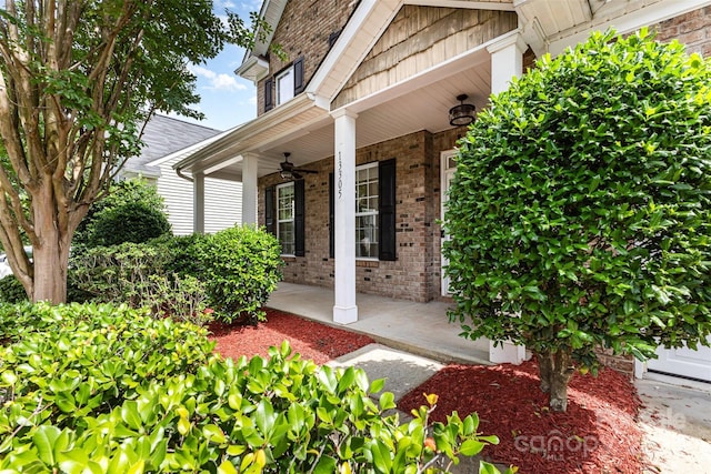 13305 Mallard Landing Rd, Charlotte, NC 28278 - doorway to property featuring covered porch and brick siding