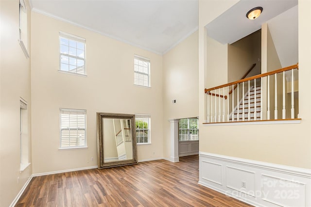 13305 Mallard Landing Rd, Charlotte, NC 28278 - foyer entrance featuring crown molding, wood finished floors, a high ceiling, plenty of natural light, and stairway