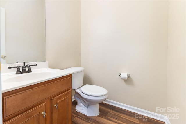 13305 Mallard Landing Rd, Charlotte, NC 28278 - half bathroom featuring baseboards, toilet, vanity, and wood finished floors