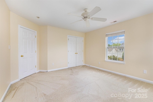 13305 Mallard Landing Rd, Charlotte, NC 28278 - unfurnished bedroom with carpet, baseboards, ceiling fan, and a closet