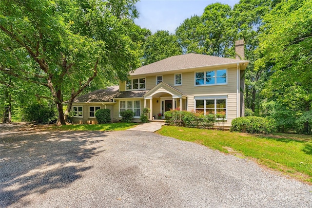 310 Southwood Ln, Columbus, NC 28722 - colonial inspired home featuring a chimney