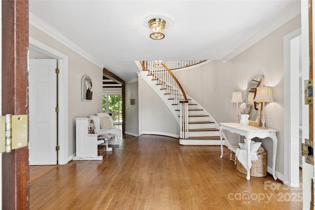 310 Southwood Ln, Columbus, NC 28722 - foyer featuring stairs, wood finished floors, and crown molding