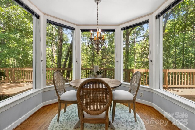 310 Southwood Ln, Columbus, NC 28722 - sunroom / solarium with wood finished floors and a chandelier