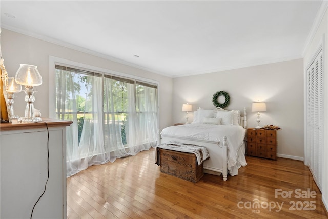 310 Southwood Ln, Columbus, NC 28722 - bedroom with light wood-style flooring and ornamental molding