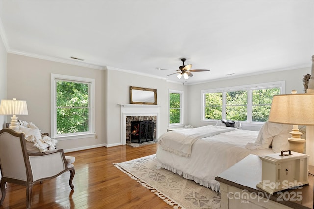 310 Southwood Ln, Columbus, NC 28722 - bedroom with wood finished floors, crown molding, a high end fireplace, and a ceiling fan